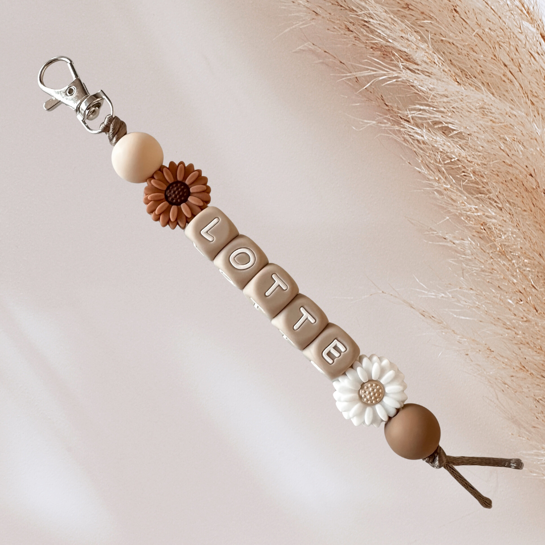 Sleutelhanger met naam bloem bruin wit