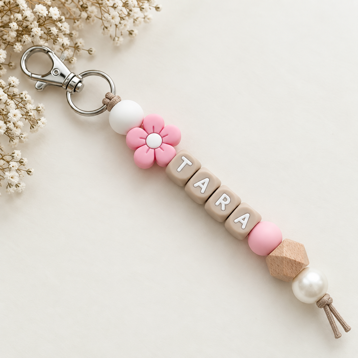Sleutelhanger met naam roze parel bloem