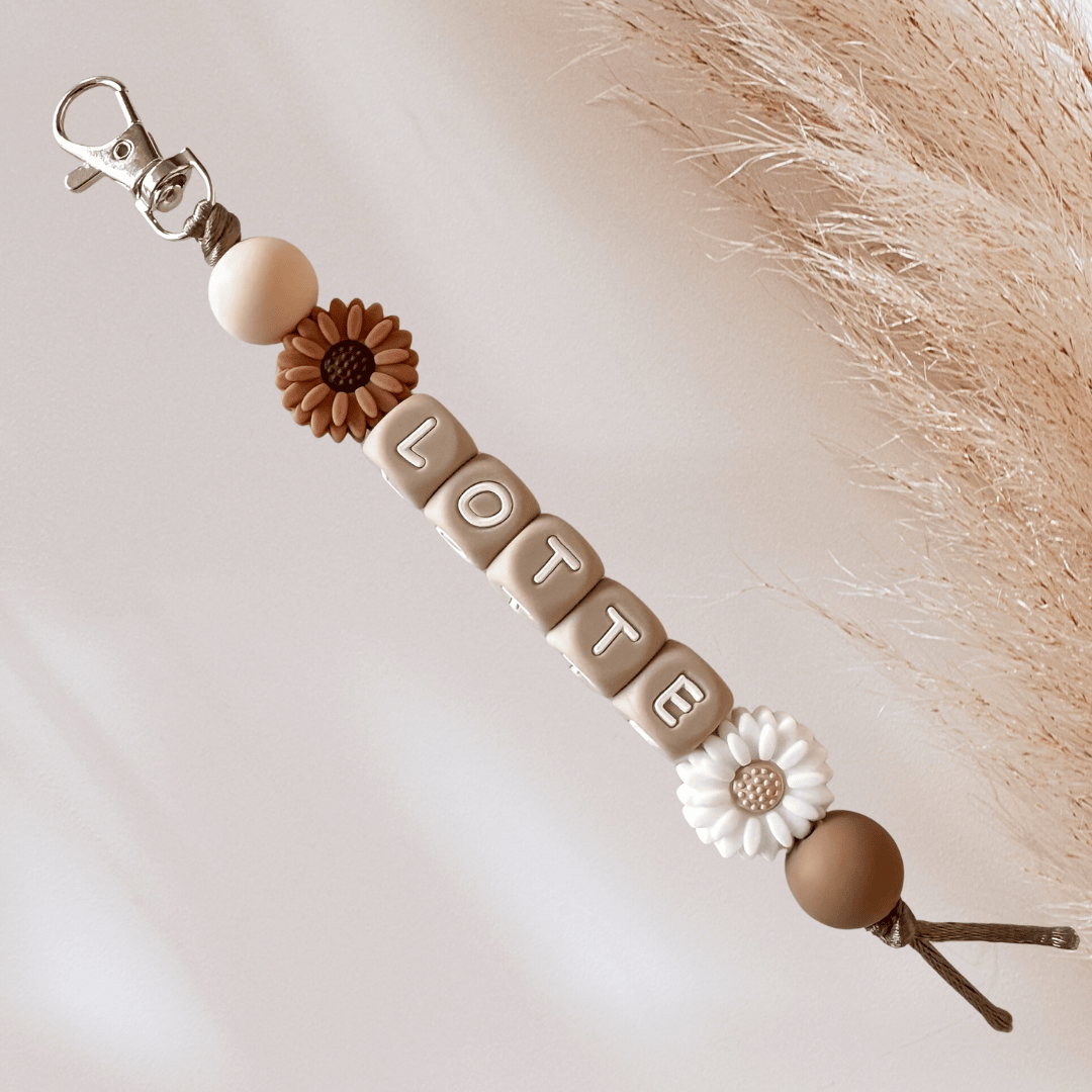 Sleutelhanger met naam bloem bruin wit