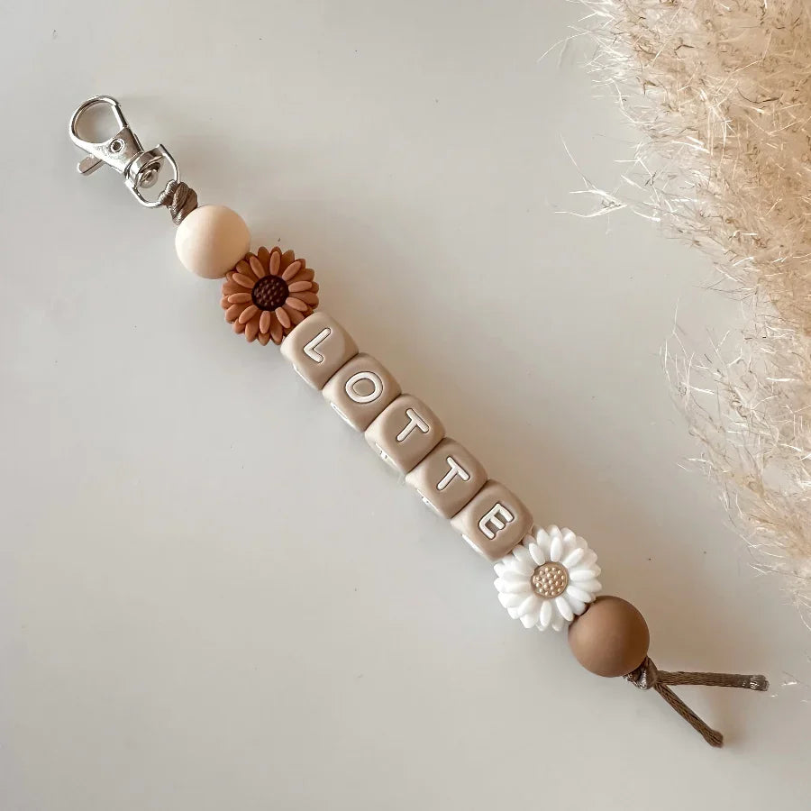 Sleutelhanger met naam bloem bruin wit