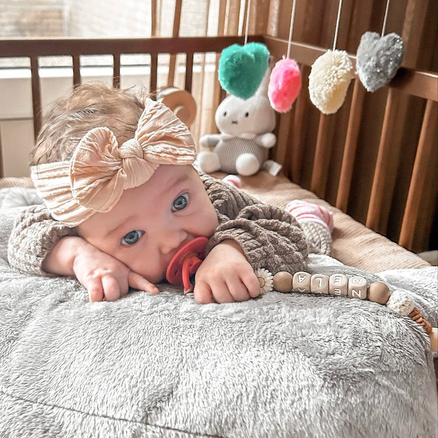 speenkooord met naam bloem bruin wit